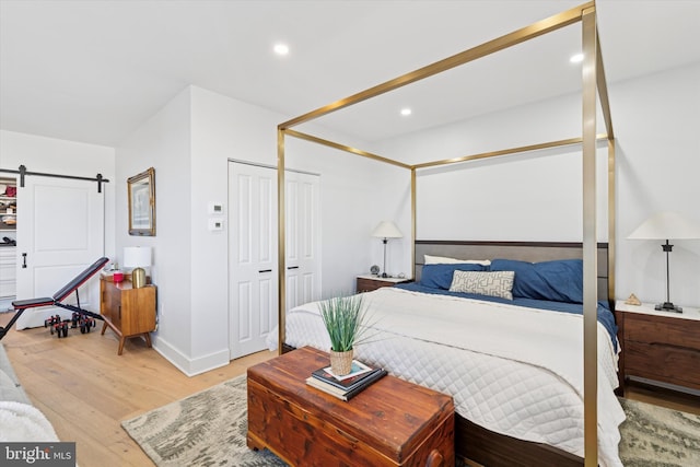 191 Presidential Blvd Unit R1018-1019, Bala Cynwyd, PA 19004 - bedroom featuring light wood finished floors, a barn door, recessed lighting, and a closet