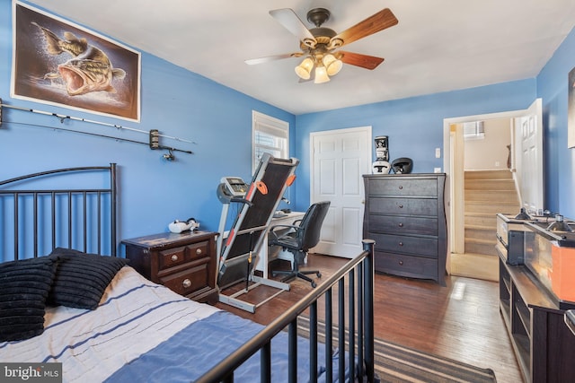 bedroom with wood finished floors and a ceiling fan