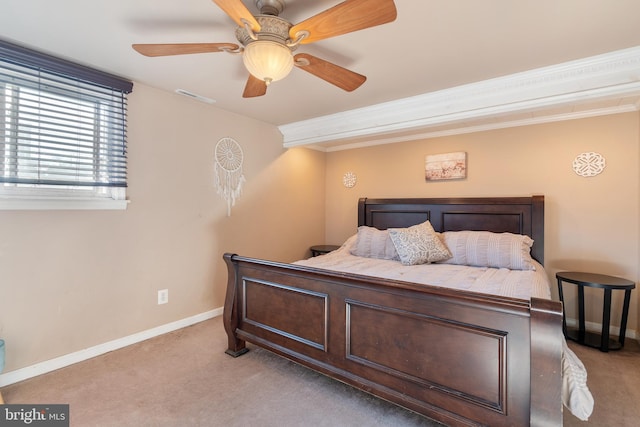 bedroom with visible vents, light carpet, baseboards, and ornamental molding