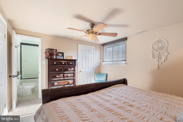 bedroom with ensuite bath, visible vents, carpet floors, and ceiling fan