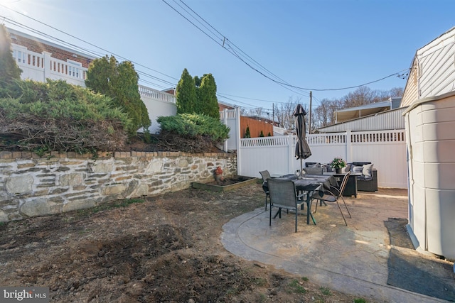 view of patio / terrace with outdoor dining area and fence