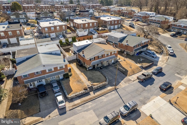 birds eye view of property with a residential view