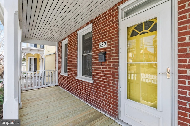 wooden terrace with a porch