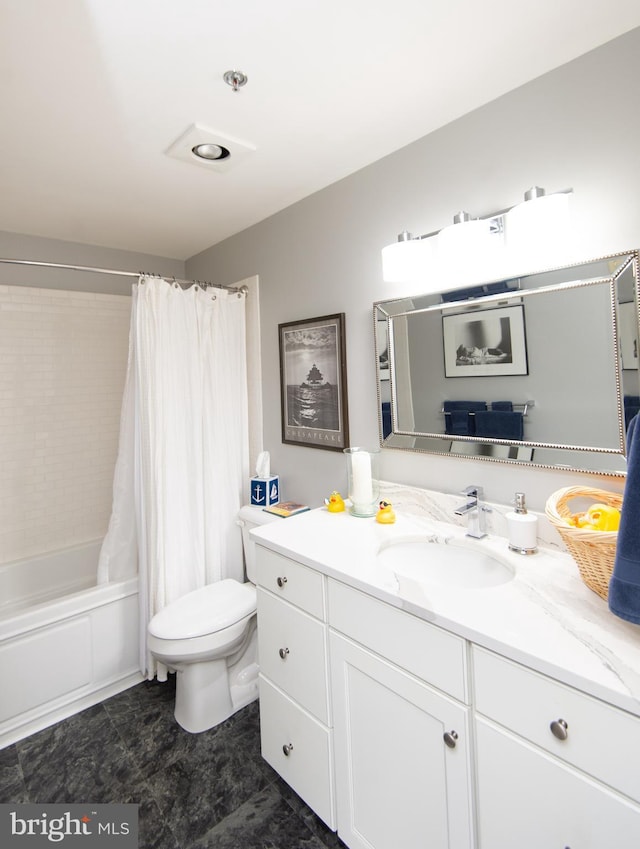 bathroom featuring toilet, vanity, and shower / bath combo