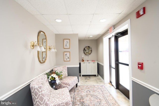 sitting room featuring recessed lighting and a paneled ceiling