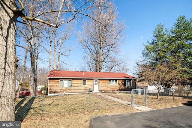 view of front of property with a fenced front yard and a front yard