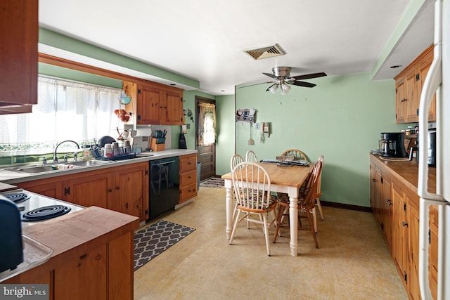 kitchen with visible vents, a ceiling fan, a sink, black dishwasher, and light countertops