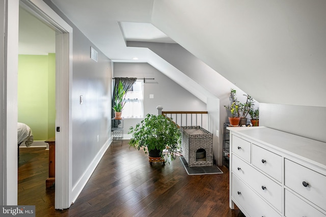 interior space featuring visible vents, dark wood finished floors, recessed lighting, baseboards, and vaulted ceiling