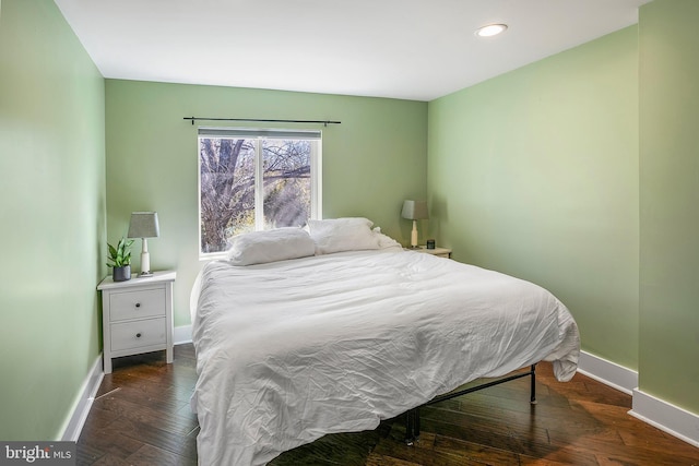 bedroom with hardwood / wood-style flooring, recessed lighting, and baseboards