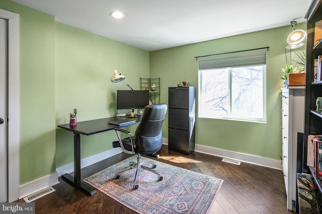 office featuring dark wood finished floors, baseboards, and visible vents