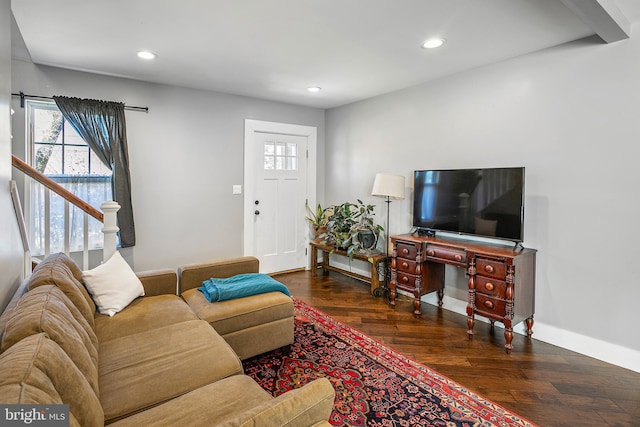 living area featuring recessed lighting, baseboards, and wood-type flooring