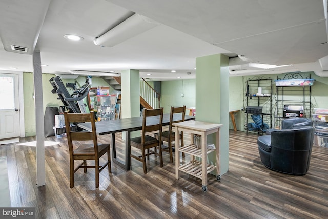 dining area featuring visible vents, recessed lighting, stairs, and wood finished floors