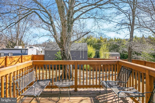 wooden deck featuring fence