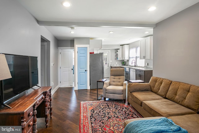 living area featuring recessed lighting, beamed ceiling, baseboards, and dark wood-type flooring