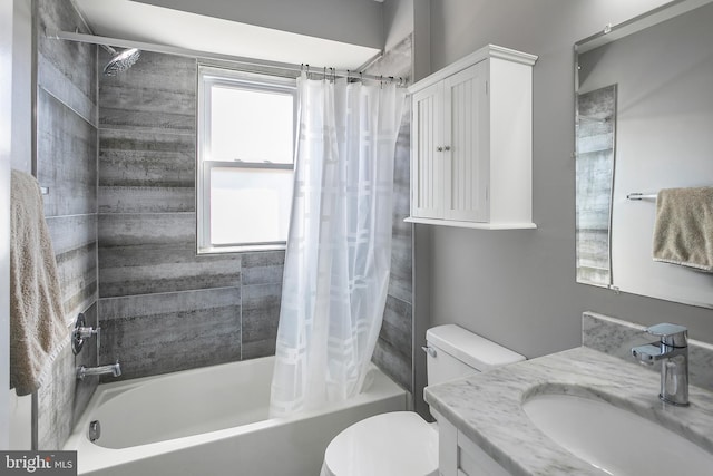 full bathroom featuring toilet, vanity, and shower / bath combination with curtain