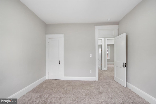 unfurnished bedroom with baseboards and carpet floors