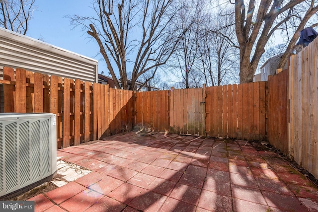 view of patio featuring a fenced backyard and central AC