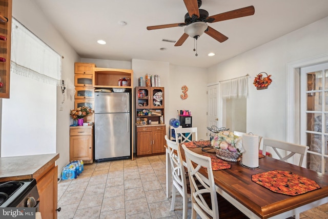 dining room with light tile patterned floors, visible vents, recessed lighting, and a ceiling fan