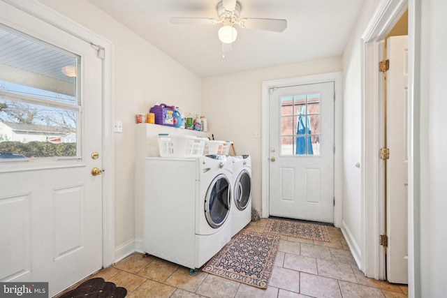 laundry room with baseboards, ceiling fan, washing machine and dryer, light tile patterned floors, and laundry area