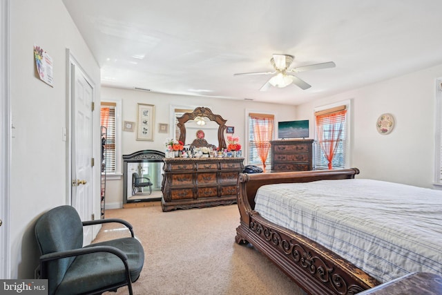 bedroom with ceiling fan and carpet flooring