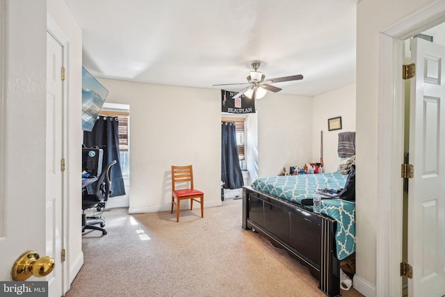 bedroom with baseboards and a ceiling fan