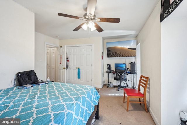 carpeted bedroom with baseboards, a closet, and ceiling fan