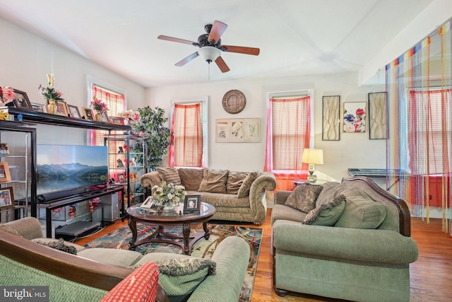 living room featuring ceiling fan and wood finished floors