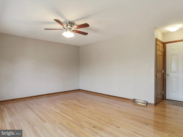 unfurnished room with a ceiling fan, baseboards, and light wood finished floors