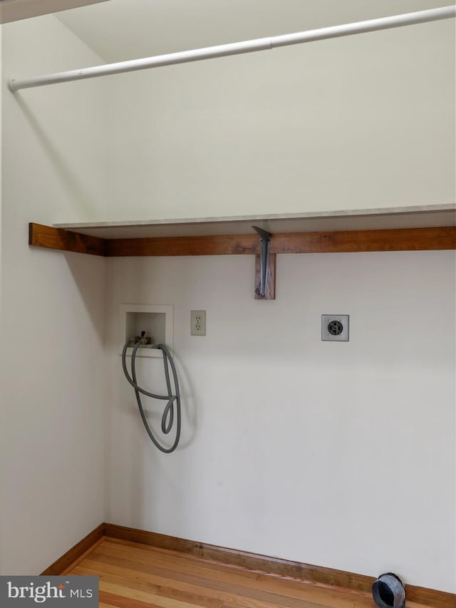 laundry room featuring baseboards, washer hookup, laundry area, light wood-style floors, and electric dryer hookup