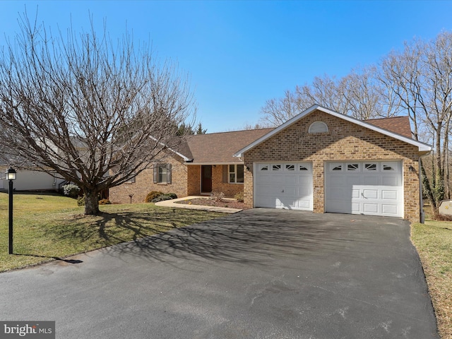 ranch-style home featuring a front yard, driveway, a shingled roof, a garage, and brick siding