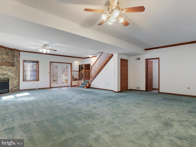 unfurnished living room with stairway, carpet flooring, and baseboards