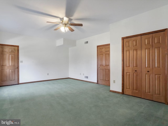 unfurnished bedroom featuring baseboards, visible vents, ceiling fan, a closet, and carpet flooring