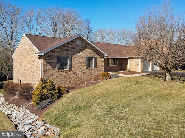 view of front of property featuring a front lawn, an attached garage, brick siding, and roof with shingles