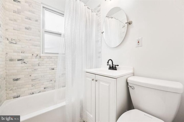 bathroom featuring shower / bathtub combination with curtain, toilet, and vanity