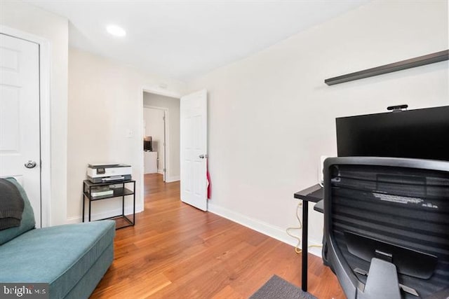 office area featuring recessed lighting, wood finished floors, and baseboards