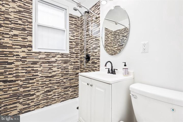 full bath with vanity, toilet, and a shower