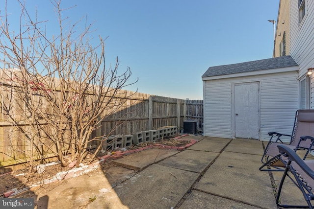 view of patio / terrace featuring central AC unit and a fenced backyard