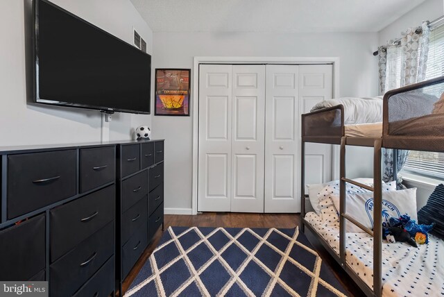 502 Dembytown Rd, Joppa, MD 21085 - bedroom with dark wood-type flooring and a closet