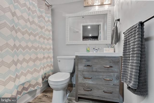502 Dembytown Rd, Joppa, MD 21085 - full bathroom featuring toilet, a shower with curtain, vanity, and wood finished floors