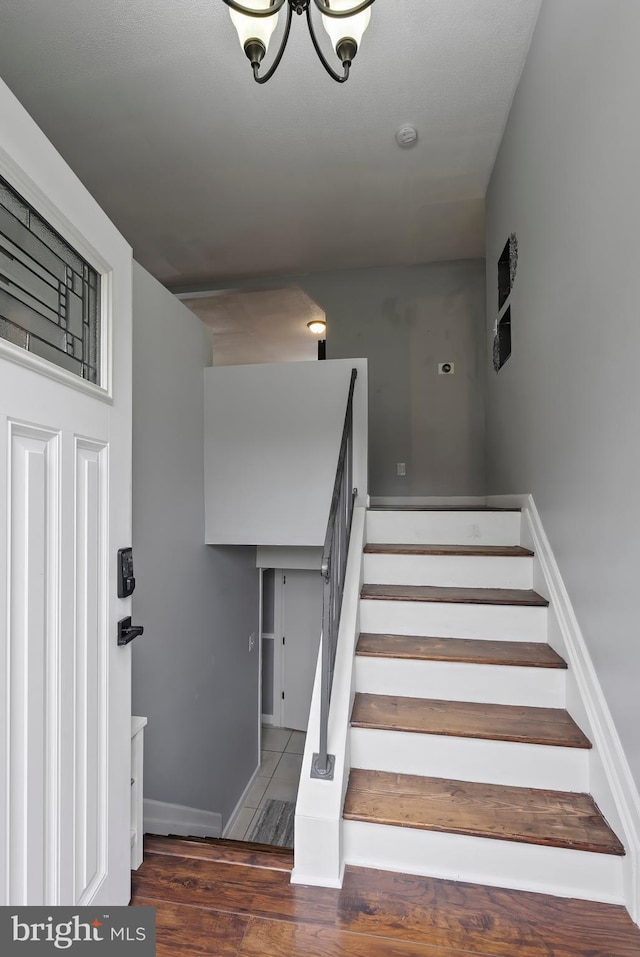 502 Dembytown Rd, Joppa, MD 21085 - staircase with wood finished floors and a notable chandelier