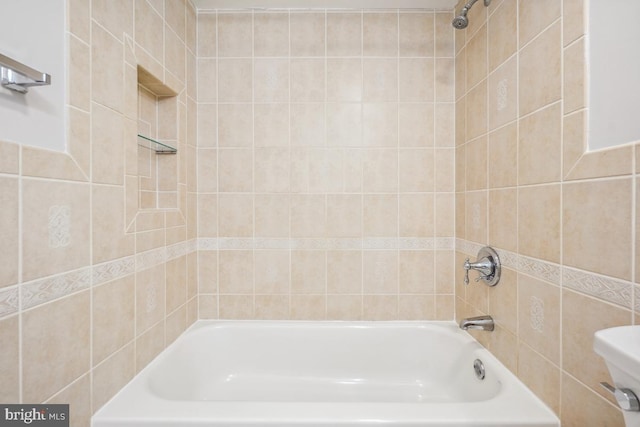 bathroom featuring toilet and tub / shower combination