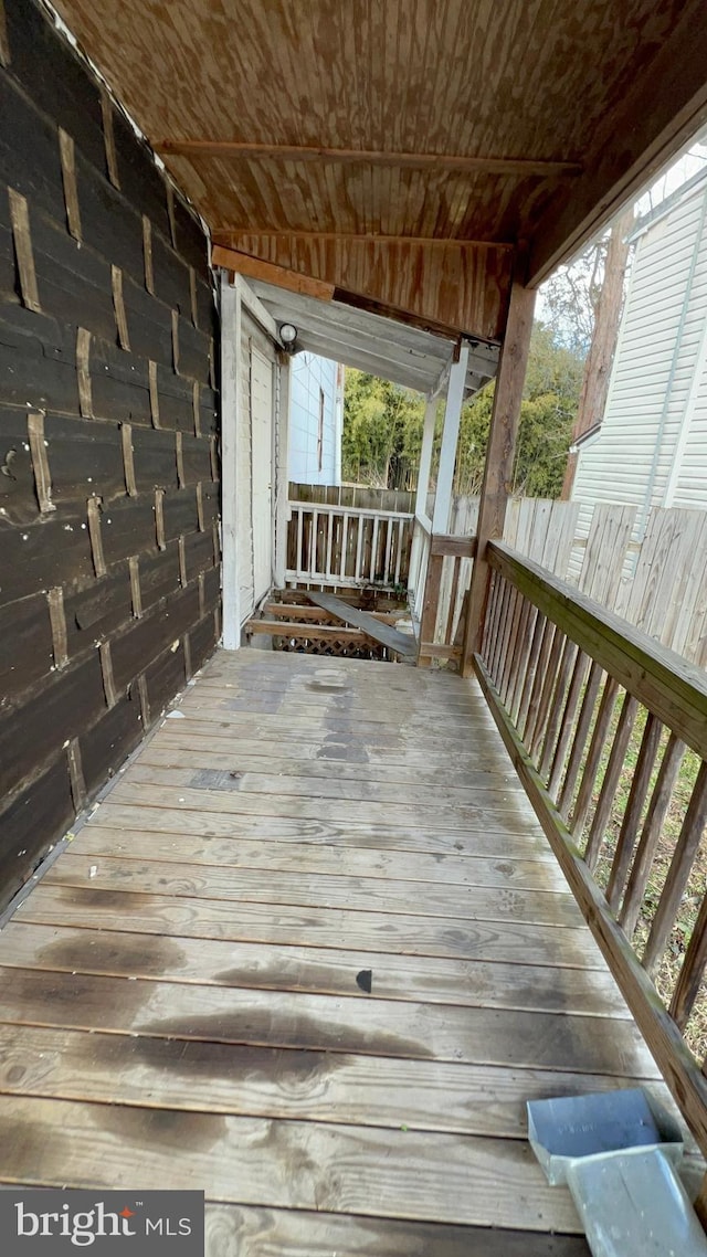 wooden deck featuring fence