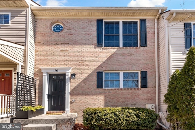 view of front of home with brick siding