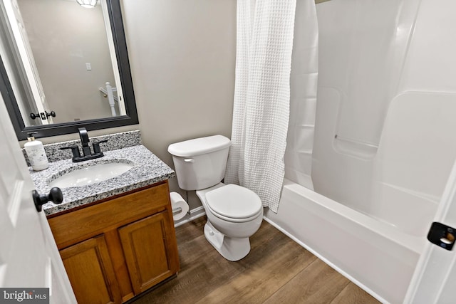 full bathroom featuring vanity, shower / tub combo, toilet, and wood finished floors