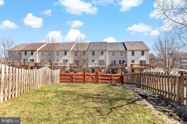 view of yard with a residential view and a fenced backyard