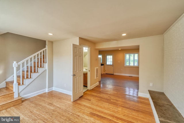 foyer entrance featuring stairway, baseboards, visible vents, light wood-style flooring, and recessed lighting