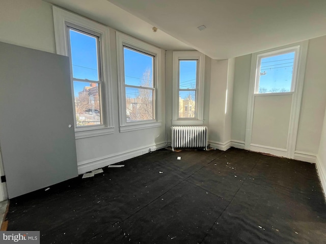 empty room featuring radiator heating unit