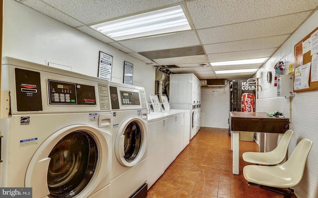 community laundry room with stacked washer / drying machine, independent washer and dryer, and light tile patterned flooring