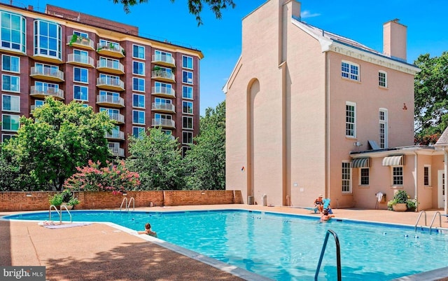 pool with a patio area