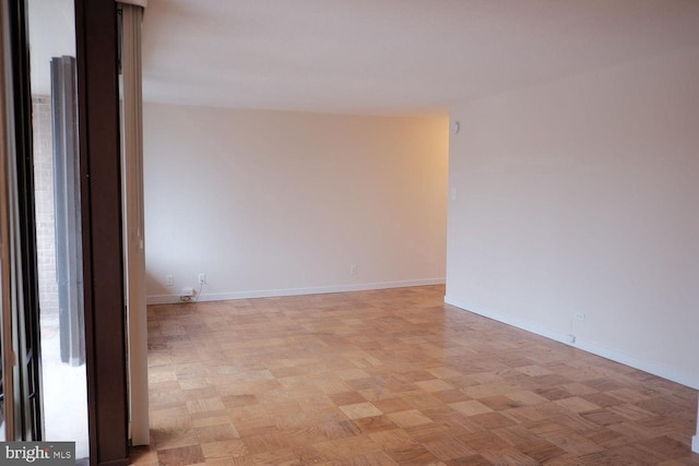 empty room with baseboards